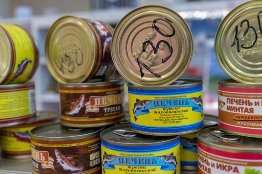Petropavlovsk-Kamchatsky, Russia-October 6, 2019: canned Fish in the seafood market showcase.