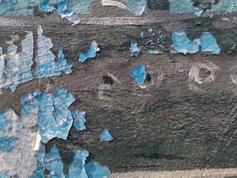 Blue background with cracked oil paint on plaster. For design and networking.