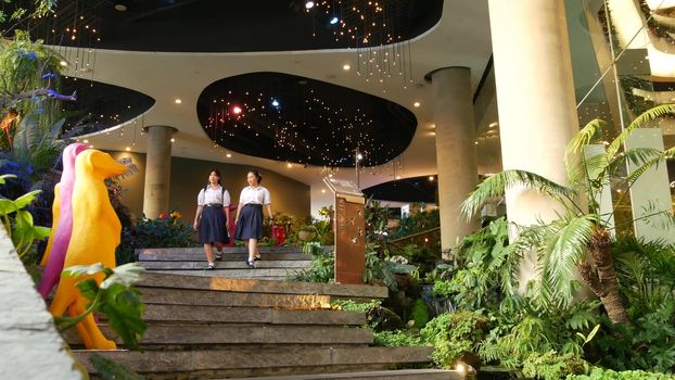 BANGKOK, THAILAND - 18 DECEMBER, 2018 The Emquartier luxury shopping center. Design of mall, green environmentally friendly concept. hanging garden, futuristic eco architecture. Modern city pedestrian