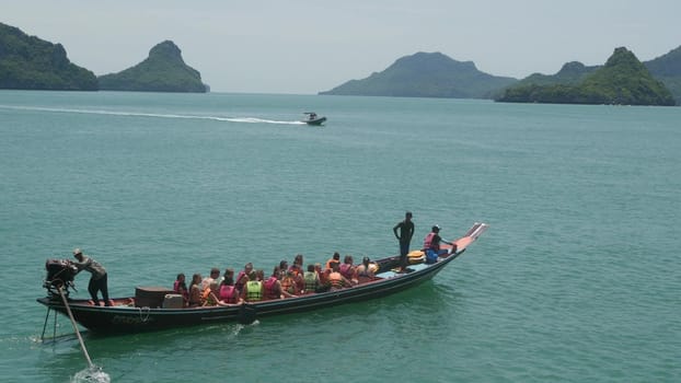 ANG THONG MARINE PARK, SAMUI, THAILAND - 9 JUNE 2019: Group of Islands in ocean near touristic paradise tropical resort. Idyllic turquoise sea with boat with tourists. Travel vacation holiday concept.