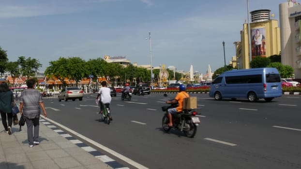 BANGKOK, THAILAND - 11 JULY, 2019: Rush hour traffic near Democracy Monument in capital. Famous asian landmark and travel destination. Democratic and patriotic symbol and public transport in downtown.