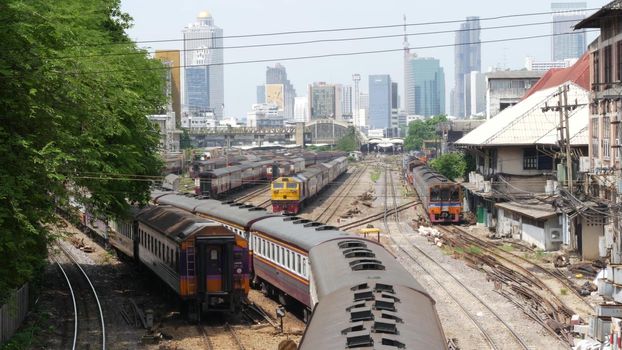 BANGKOK, THAILAND - 11 JULY, 2019: View of the train station against the backdrop of the cityscape and skyscrapers. Hua Lamphong is the hub of public transportation. State railway transport in Siam