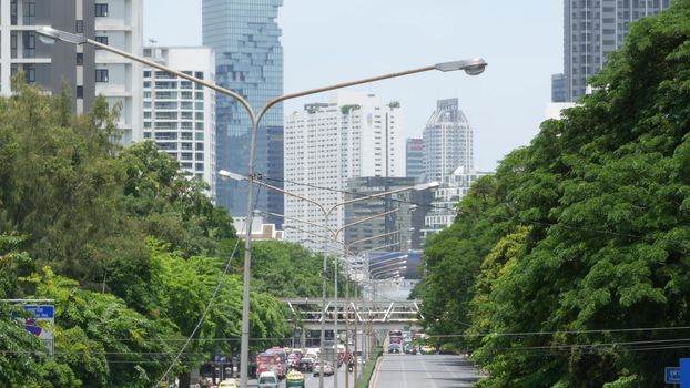 BANGKOK, THAILAND - 13 JULY, 2019: Mahanakhon King Power skyscraper in modern Sathorn financial business district. Maha Nakhon - tallest futuristic building. Rush hour traffic, cars and bts skytrain.