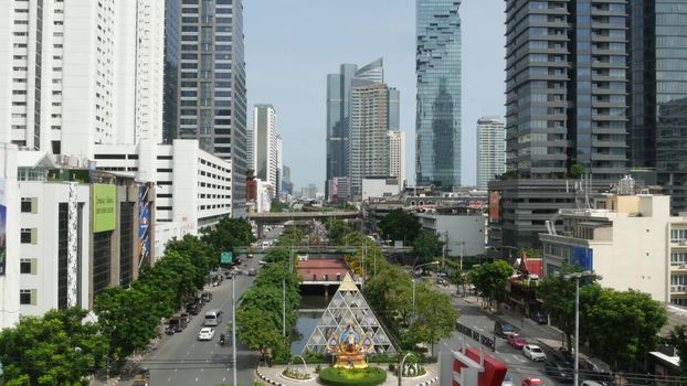 BANGKOK, THAILAND - 13 JULY, 2019: Mahanakhon King Power skyscraper in modern Sathorn financial business district. Maha Nakhon - tallest futuristic building. Rush hour traffic, cars and bts skytrain.