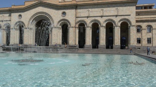 YEREVAN, ARMENIA, CAUCASUS - 28 AUGUST 2019: Central Republic Square, caucasian armenian capital, soviet architectural heritage, downtown classical street city life on sunny day. Kentron architecture.