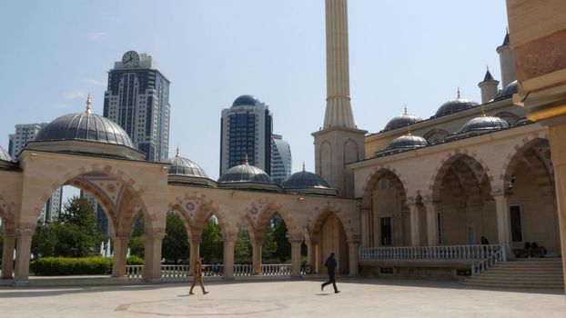 GROZNY, THE CHECHEN REPUBLIC OF ICHKERIA, CAUCASUS, RUSSIA - 6 SEPTEMBER 2019: Day of Civil Concord and Unity celebration in capital near The Heart of Chechnya. People on square near islamic mosque