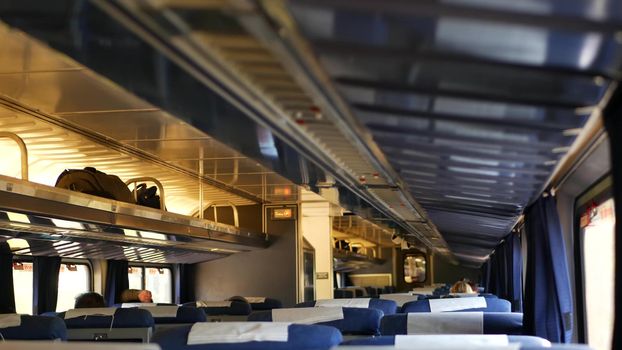 LOS ANGELES, CALIFORNIA, USA - 24 OCT 2019: Amtrak Pacific Surfliner commuter, express train car inside. Passenger rapid rail transportation along the ocean. Railway on west coast. Railroad in suburb.