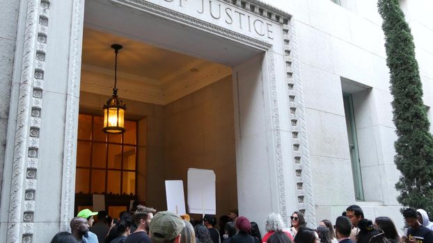 LOS ANGELES, CALIFORNIA, USA - 30 OCT 2019: People strike near Hall of Justice. Protest picket in front of Sheriff's Department and Courthouse. Demonstration of activists near LA government building.