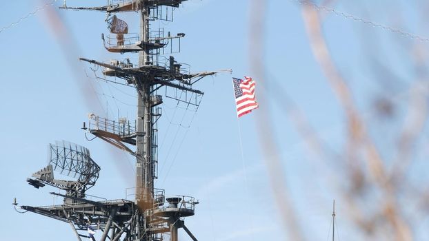 SAN DIEGO, CALIFORNIA USA - 4 JAN 2020: Radar of USS Midway military aircraft carrier, historic war ship. Naval army battleship with American flag. Maritime steel warship in port, navy fleet symbol.