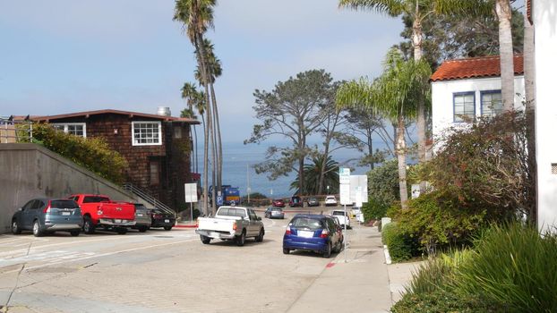 La Jolla, San Diego, CA USA -24 JAN 2020: Cars and buildings, downtown city street of californian coastal tourist resort. Cityscape with traffic, american travel destination for holidays and weekend.