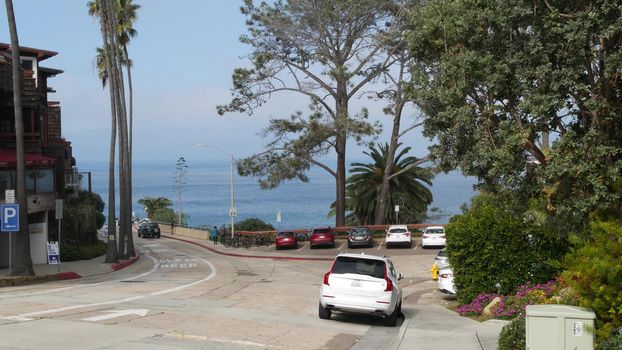 La Jolla, San Diego, CA USA -24 JAN 2020: Cars and buildings, downtown city street of californian coastal tourist resort. Cityscape with traffic, american travel destination for holidays and weekend.