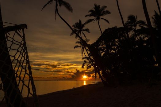 Colorful sunrise on Tambua Sands Beach on Fiji Island, Fiji.