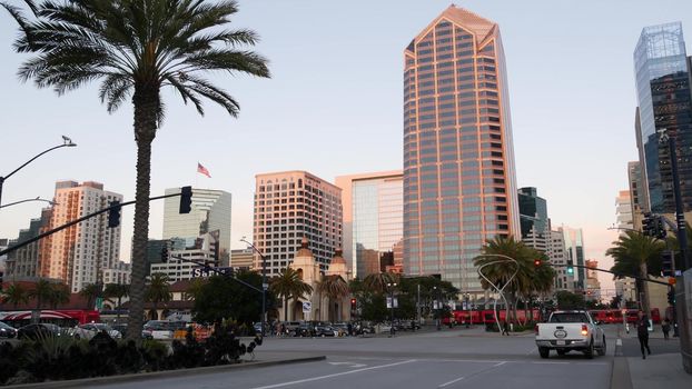 SAN DIEGO, CALIFORNIA USA - 13 FEB 2020: Pedestrians, traffic and highrise buildings, city downtown. Street life of american metropolis. Urban Broadway street, MTS trolley and citizens near Santa Fe.