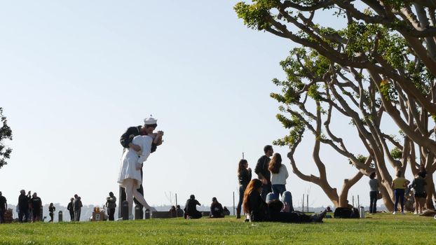 SAN DIEGO, CALIFORNIA USA - 23 FEB 2020: Unconditional Surrender Statue, USS Midway Museum. Symbol of navy fleet and Victory over Japan Day. Sailor kissing a woman, World War II memorial sculpture.