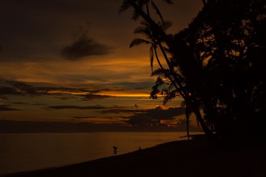 Colorful sunrise on Tambua Sands Beach on Fiji Island, Fiji.