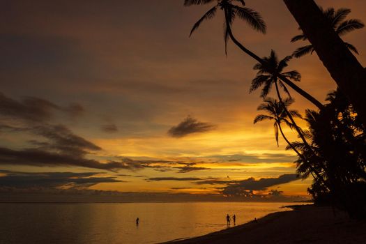 Colorful sunrise on Tambua Sands Beach on Fiji Island, Fiji.