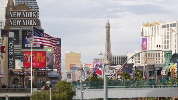 LAS VEGAS, NEVADA USA - 7 MAR 2020: The Strip boulevard with luxury casino in gambling sin city. Car traffic on road to Fremont street, tourist money playing resort. New York hotel and Liberty Statue.