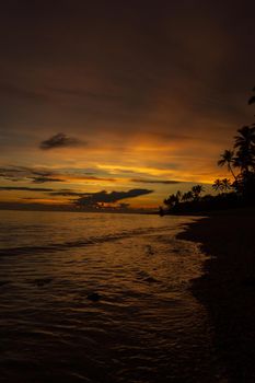 Colorful sunrise on Tambua Sands Beach on Fiji Island, Fiji.