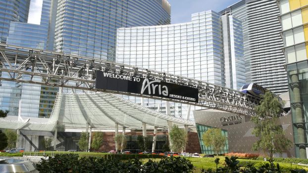 LAS VEGAS, NEVADA USA - 7 MAR 2020: Futuristic CityCenter casino complex in sin city. Modern luxury unincorporated urban skyline. Contemporary metropolis highrise skyscraper and monorail express train