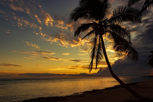 Colorful sunrise on the Tambua Sands Beach on Fiji Island, Fiji.
