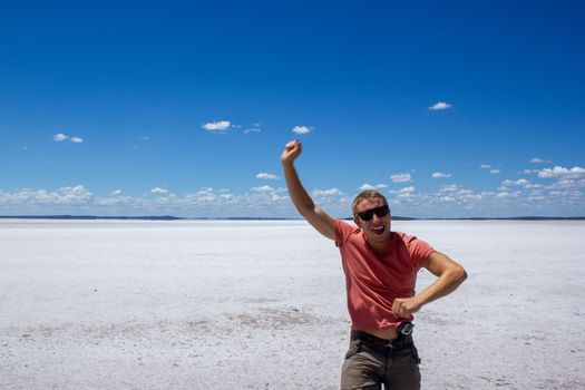 time to relax for a man walking on a salt lake in western