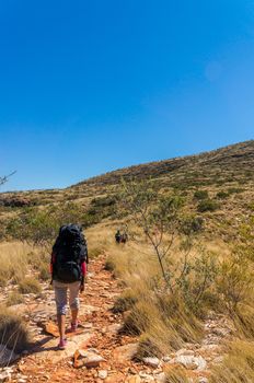 Hiker at the top of Mount Gillen just outside Alice Springs in central Australia.