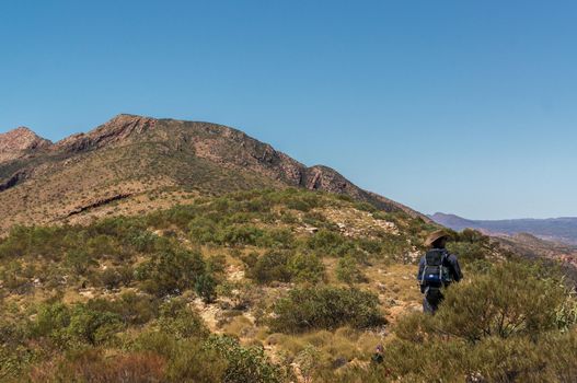 Hiker at the top of Mount Gillen just outside Alice Springs in central Australia.