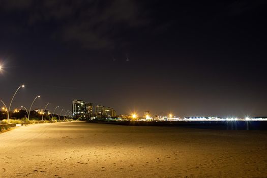 view over melbourne at night from a beach