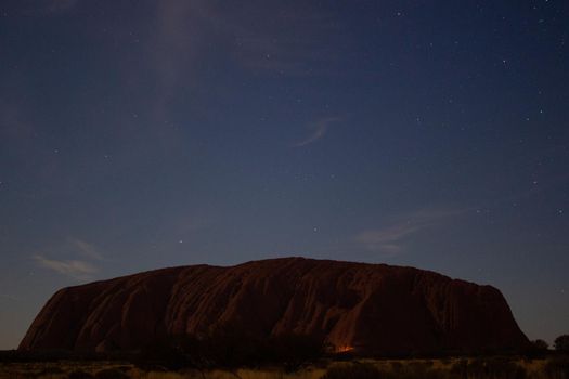 Uluru at night with car in front, ayers Rock, the Red Center of Australia