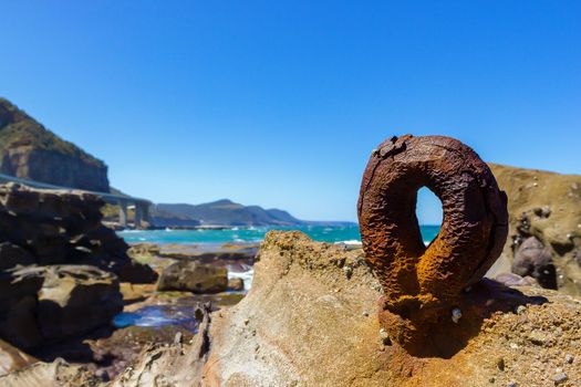 an old rusty round hook from the historic Sea Clliff Bridge along the Grand Pacific Drive, Australia
