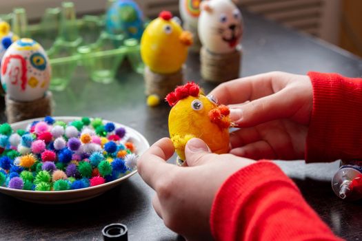 A child makes gifts with his own hands for Easter