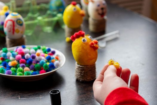 A child makes gifts with his own hands for Easter, a decorative element in the child's cancer