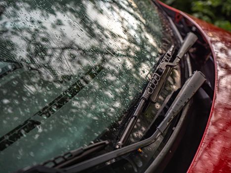 Close up of car windshield wipers in red car