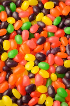 A full vertical frame of many various jelly bean candy to create a sweet background.