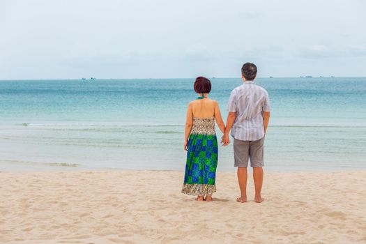 Middle aged couple relaxing at chaweng beach in koh samui ,Thailand.