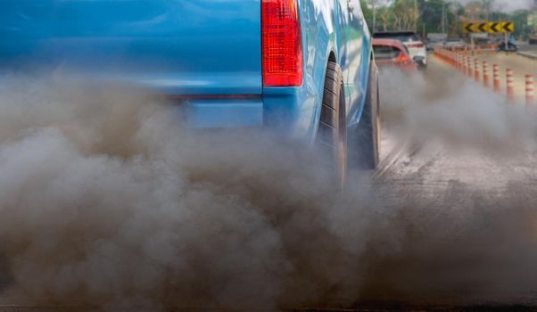 air pollution crisis in city from diesel vehicle exhaust pipe on road