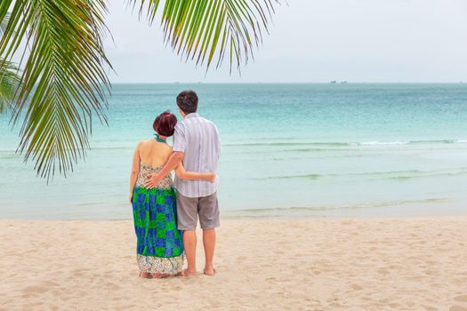 Middle aged couple relaxing at chaweng beach in koh samui ,Thailand.