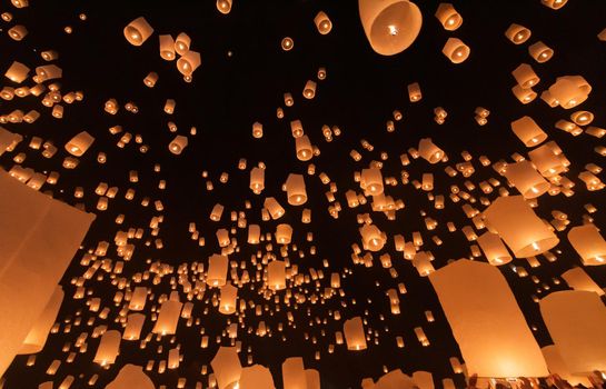 Tourist floating sky lanterns in Loy Krathong festival , Chiang Mai ,Thailand.