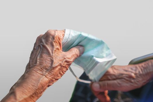 Elderly woman prepare wearing a mask to protect from  covid-19