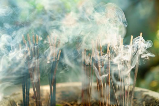 burning aromatic incense sticks. Incense for praying hindu and buddha