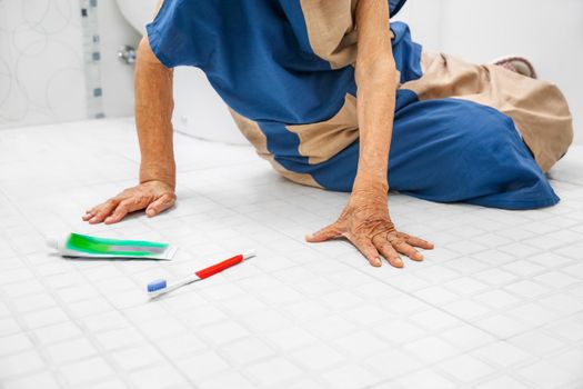 elderly woman falling in bathroom because slippery surfaces