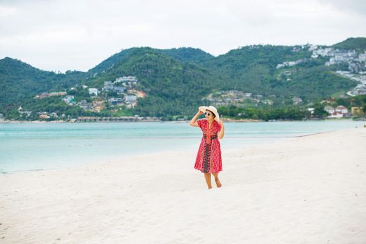 Middle aged woman relaxing at chaweng beach in koh samui ,Thailand.