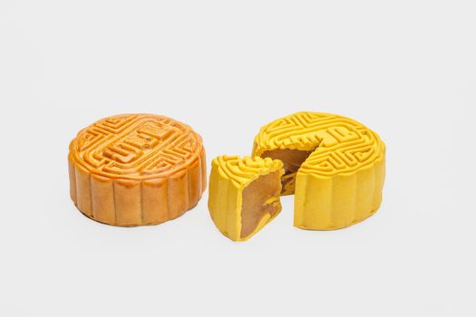 Traditional mooncake with durian and nuts filling on white background