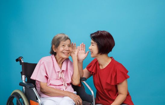 Asian seniors woman hearing loss , Hard of hearing try to talk with daughter.
