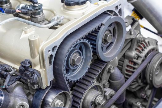 Timing belt and twin camshaft sprocket in engine racing car.