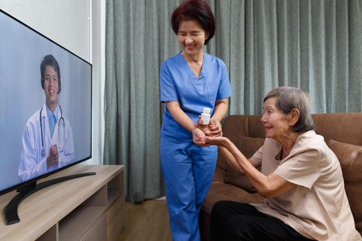 Elderly woman sit at home having online consultation with doctor