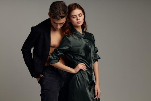 Cute men and women studio lifestyle embrace passion fashion. High quality photo