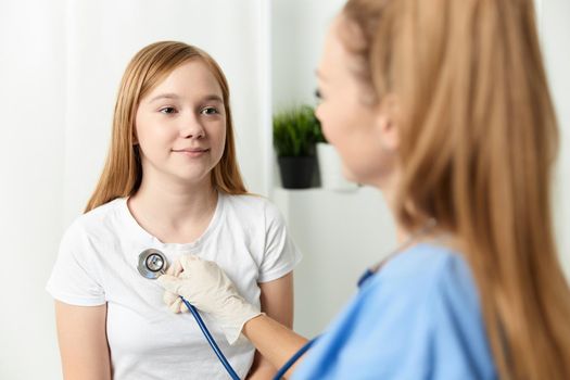 doctor examines the girl treatment hospital health care. High quality photo