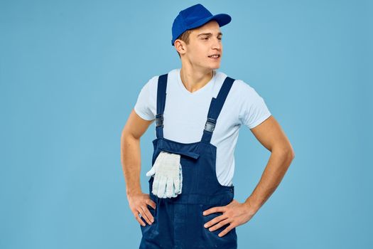 Working man uniform delivery service blue background. High quality photo