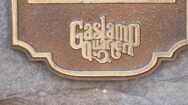 SAN DIEGO, CALIFORNIA USA - 13 FEB 2020: Historic old-fashioned Gaslamp Quarter sign on building wall. Retro signboard on 5th ave. Iconic vintage nameplate signage. Tourist landmark and sightseeing.